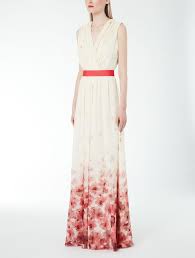 Femminile silhouette a farfalla con gonna a mezza ruota e top a kimono, ha delicate increspature sulle spalle grazie a piccole coulisse con nastri da allacciare sulla schiena. Max Mara Vestito Fiori 8d10f9