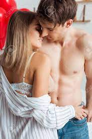 Happy Woman With Big Breast Touching Muscular Boyfriend Stock Photo,  Picture and Royalty Free Image. Image 139531997.