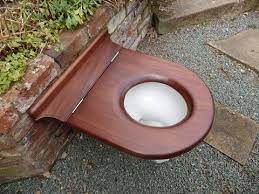 Where the bolts go through the toilet there is a round metal disk with 4 holes and 1 screw.i had to keep turning the metal disks until the distance between the threaded rod would fit through the holes in toilet. Antique Mahogany Wooden High Level Throne Toilet Seat Wooden Toilet Seats Toilet Seat Antique Restoration