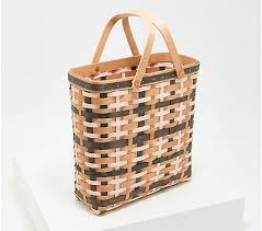 Longaberger is a company that sells handcrafted baskets and other home products through a network marketing business model. Longaberger For Isaac Mizrahi Live Woven Grocery Tote Qvc Com