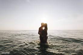 Download Premium Image Of Romantic Couple In The Sea At Sunset 418350 Romantic Couples Photo Powerful Love Spells