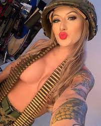 US Marine is dubbed 'Combat Barbie' for her sexy photoshoots mimicking  classic Army pin