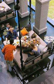 at kroya restaurant in shinta mani club diners can opt to have their meals on a giant daybed swing that s suspended over a tran hotel bar hotel boutique hotel