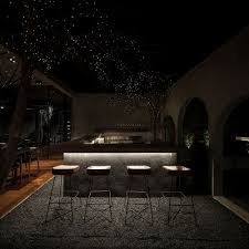 Dark Ceiling And Led Lights Bring The Visual Of Fireflys In The Night Sky Dark Ceiling Dark Restaurant Bar Ceilings