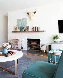 Hard to design around the off centered fireplace and wood storage, but i guess it reflects the age of the house. Remodelaholic Decorating Around An Off Center Non Functional Fireplace
