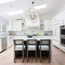 Building angled cabinets to work with sloped ceiling attic rooms. White Wood Panel Sloped Kitchen Hood Design Ideas