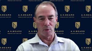 Allyn Beard speaking to journalist Damon Kitney