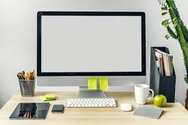 Premium Photo Computer Monitor With Mockup White Screen On Office Table With Supplies Powerpoint Background Design Wallpaper Powerpoint Photoshop Design Ideas