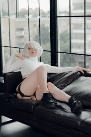 women, model, women indoors, cosplay, Alina Becker, video game girls, video  game characters, short hair, white hair, 2B (Nier: Automata), looking away,  sitting, hair over one eye, thighs, wide hips, bent legs,