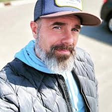 Word for high pitched adenoidal voice?