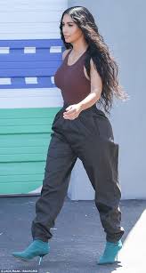 Kourtney kardashian models neon cycling shorts and bra top from upcoming yeezy season 7. Kim Kardashian Flaunts Her Hourglass Physique In Skin Tight Bodysuit Yeezy Fashion Fashion Yeezy Fashion Women