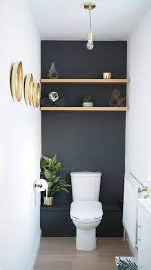 Panel molding and chair rails are most closely associated with traditional homes, but wood trim in geometric and repetitive shapes. Bold Black Accent Wall Ideas Small Toilet Room Small Bathroom Makeover Bathroom Decor