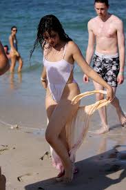 Camila cabello was spotted enjoying her beach vacation in swimsuit in miami. Camila Cabello Wears A White Swimsuit During A Pda Filled Beach Day With Shawn Mendes In Miami Florida 290719 23