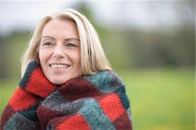 Person wrapped in a blanket Stock Photos