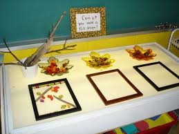 Light Table Using Fall Manipulatives And Frames From The Dollar Store To Provoke Design Making Light Box Activities Light Table Autumn Activities