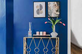 Deep green and bright gold work wonders together as fabrics, art, and paint colors. An Art Deco Interior Design Guide