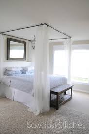 Making your own with sheer curtains or your chosen fabric is simple and will save money compared to purchasing a play tent or canopy bed. Simple Diy Bed Canopy Round Up Ideas Canopy Bed Diy Black Canopy Beds Diy Bed