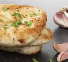A Turmeric Garlic Naan Recipe That S Surprise Gluten Free Garlic Naan Recipe Gluten Free Naan Garlic Naan