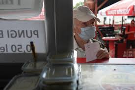 Pandemia declansata de infectia cu noul coronavirus poate fi stopata in in ce consta noutatea vaccinului anti covid? Romanians Queue For Covid 19 Vaccine And Free Barbecue At Bustling Market Reuters
