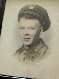 Who is the man with blonde hair and blue eyes?