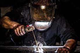 Man Welding Metal And Sparks Metal Metal Welding Welders Welding