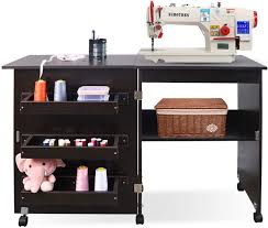 It doesn't matter what you enjoy, be it relaxing hobbies or extreme sewing, a sewing machine table can add great value to your home. Amazon Com Folding Sewing Table Multifunctional Sewing Machine Cart Table Sewing Craft Cabinet Table With Storage Shelves Portable Rolling Sewing Desk Computer Desk With Lockable Casters Brown Kitchen Dining