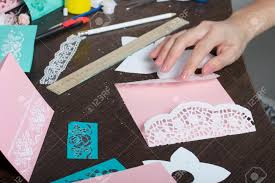 Depending on what kind of greeting card you plan to make, you'll need glue, scissors or a paper cutter, paper or blank cards. Making Greeting Cards From Paper Cardboard And Tape Woman Artisan At Work Stock Photo Picture And Royalty Free Image Image 117065945