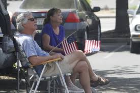 Butte County residents assemble near Oroville Hosptial for Air Force  flyover