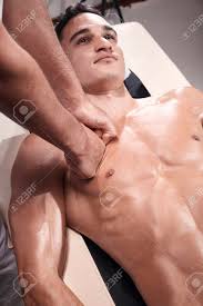 Subscribe to our free newsletters to receive latest health news and alerts to your email inbox. Two Young Man 20 29 Years Old Sports Physiotherapy Indoors In Studio Photo Shoot Physiotherapist Massaging Muscular Patient Chest Abdomen With His Hands Upper Body Shot With Abdomen Stock Photo Picture And Royalty