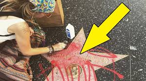 Paris jackson was furious at vandals who put graffiti on michael jackson's hollywood star (image: Paris Jackson Cleans Michael Jackson S Defaced Hollywood Star Youtube