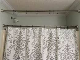 Wedge the tension rod into place, making sure to hold one end over the mark on one side of the shower while compressing the rod onto the other mark on the opposite side. How To Hang Two Shower Curtains On One Rod Shower Drape
