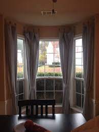 Great Idea To Hang Curtains In A Bay Window Without Expensive Curtain Rods Decorating Small Spaces Bedroom Hanging Curtains Kitchen Window To Living Room