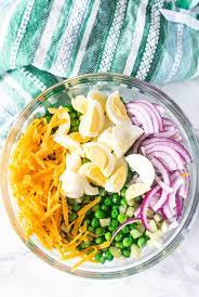 Pea salad with big chunks of cheese and bits of bacon. Creamy Easy Pea Salad Recipe English Pea Salad