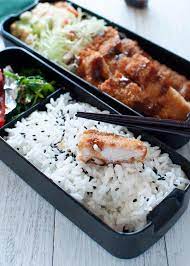 Tonkatsu Bento With A Piece Of Half Bitten Tonkatsu On The Rice Bento Recipes Japanese Food Bento Tonkatsu