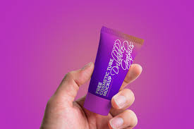 Free Man Holding Cosmetic Tube Mockup Psd Mockup Cosmetics Mockup Psd