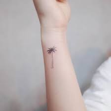 Small palm tree tattoo on the left wrist. Palm Tree Tattoo On The Wrist Palm Tattoos Palm Tree Tattoo Small Tattoos For Guys Arm