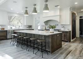 In very large kitchens, movable islands are popular because they simply allow cooks to take fewer steps between work surfaces. Classic Airy Garden Ridge Kitchen Cross Luxury Remodeling