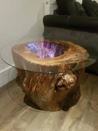 Depending on the decor of your space, you can pick from a variety of styles like modern, traditional, rustic and more. Rustic Glass Top Coffee End Table With Hollow Stump And Colour Changing Remote Led Light Wood Table Design Glass Top Table Resin Table