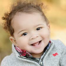 Vine and Sondi Carter Holding Mistletoe with Baby Boy