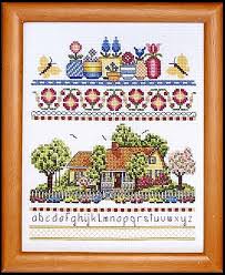 Antique white fabric using dmc floss. Crossstitch Warehouse A Sunshine Garden Kit