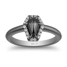 Since the overall shape is traditional, the ring still feels classy, not flashy. Elegant Goth Wedding Rings Black Diamonds Skulls Sinister Details Offbeat Bride
