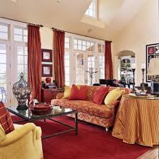 Windows are a dramatic backdrop for ethan allen's quincy bed, with roman shades from the shade store. Red And Gold Living Room Houzz