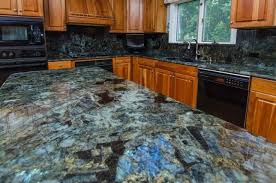 Gani stone lapis lazuli is carefully cut and pieced together. Kitchen Countertops Blue Granite Blue Granite Countertops Granite Kitchen