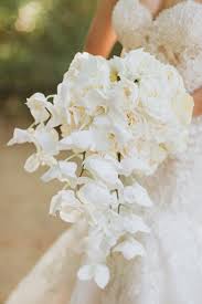 Maybe you would like to learn more about one of these? Glamorous White Orchid And Rose Bouquet