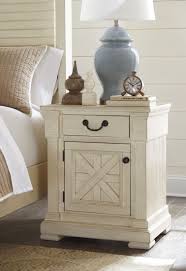 The set includes a bed, two cabinets, a dresser with a mirror. Bolanburg White Louvered Panel Bedroom Set 1stopbedrooms