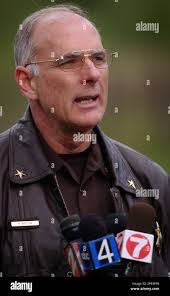 Kootenai County Sheriff Rocky Watson speaks to the media about the details  of a triple homicide near Coeur d'Alene, Idaho, Tuesday, May 17, 2005.  Three people were found slain in a home,