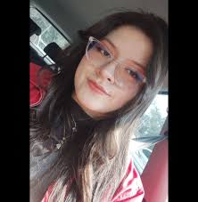 Horror movie characters sitting in the back of an ambulance after almost  dying