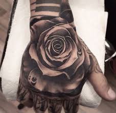 Black And White Rose Tattoo Designs Black And White Rose Tattoo Hand Tattoos For Guys Rose Hand Tattoo Black Ink Tattoos
