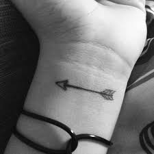 Black and white arrows tattoo on wrist. Amazing Arrow Tattoo Design For Female