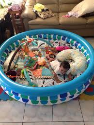 Diy Playpen Here Is A Creative Waay To Secure Your Babies Play Area A Kids Pool That Is 3 Ringed And Then Just Put Baby Play Areas Baby Life Hacks Baby Play